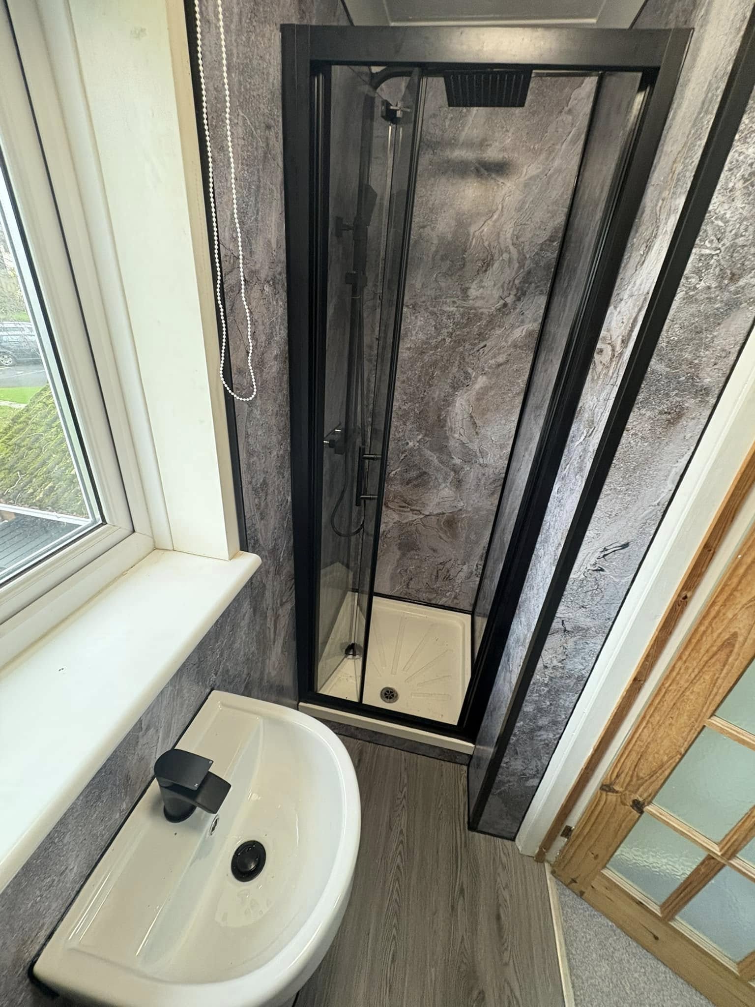 Newly refurbished bathroom and fitted shower custom fitted for a very small room