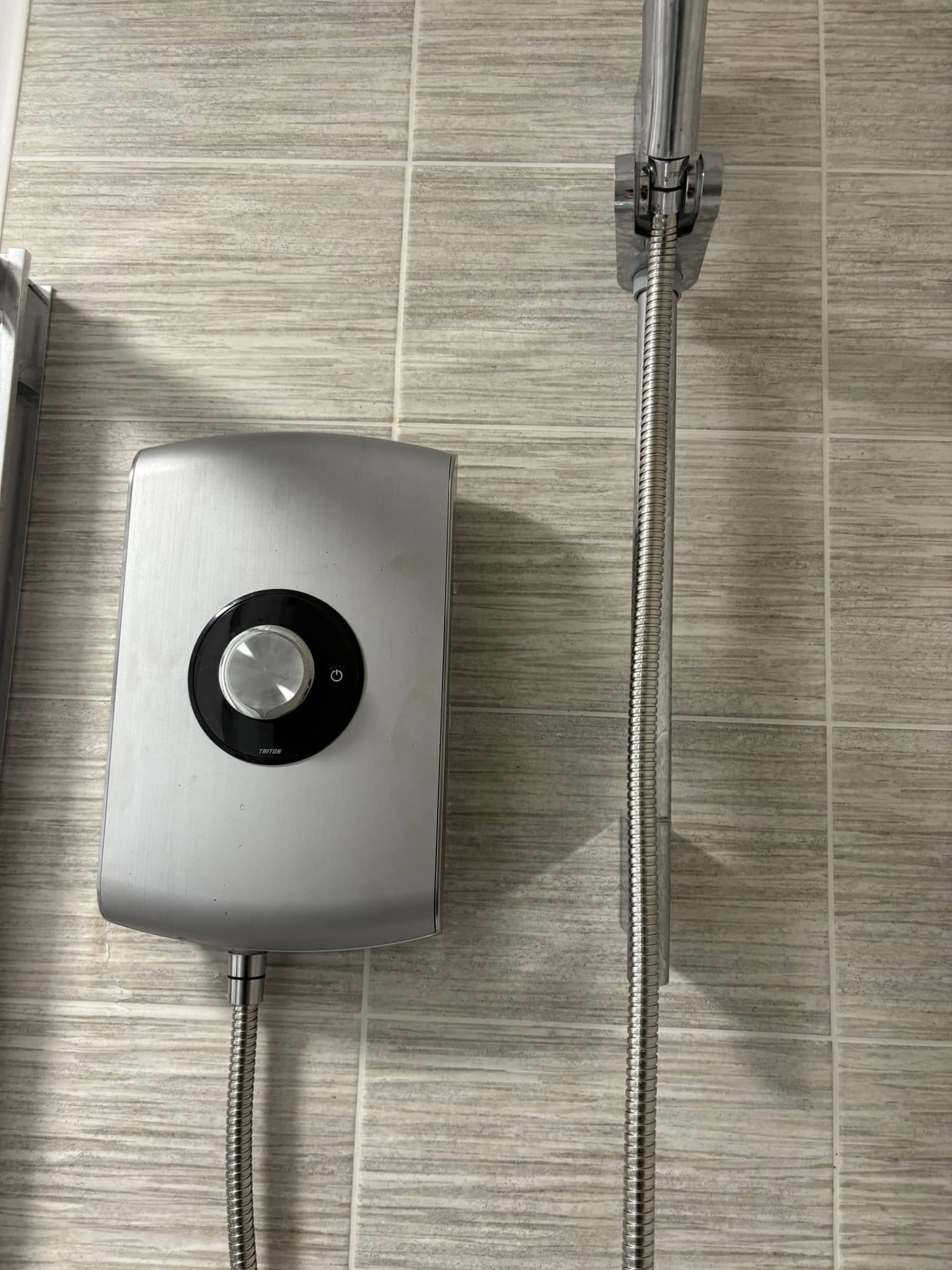 Recently Installed power shower on new bathroom tiles